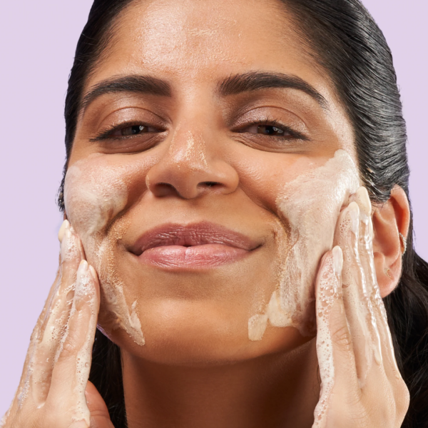 Image of a woman enjoying exuviance clarifying cleanser