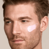 image of male model with zelens spf on his face