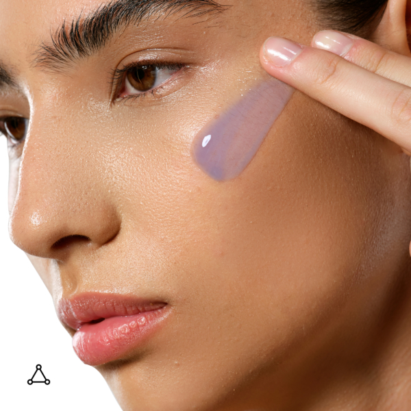 Woman applying Allies of Skin Copper Tripeptide And Ectoin Advanced Repair Serum to face with visible lightweight gel texture