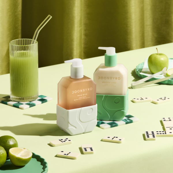 Joonbyrd Wonder Land Hand Lotion elegantly styled in an aesthetic setting, highlighting hydration and skin-softening benefits.