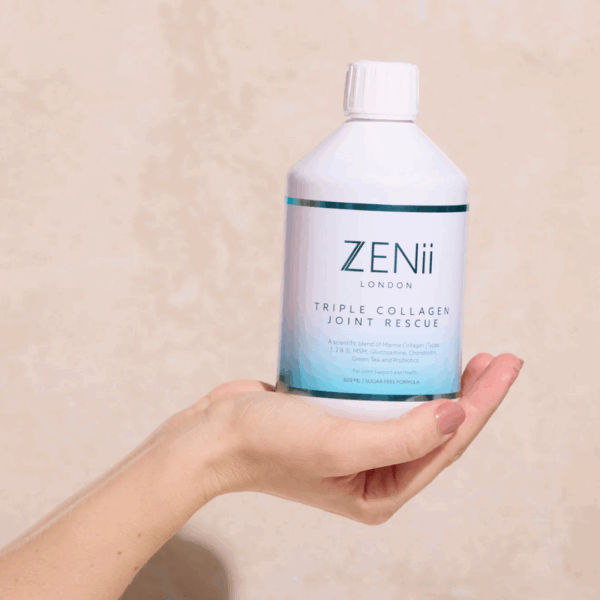 Hand holding Zenii Triple Collagen Joint Rescue 500ml bottle, showcasing its size and ergonomic design for daily supplement use