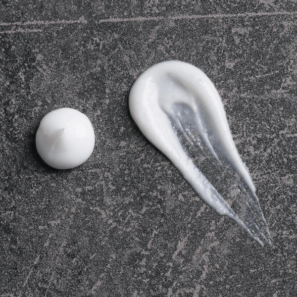 Close-up of Medik8 Smooth Body Scrub texture showing exfoliating creamy base