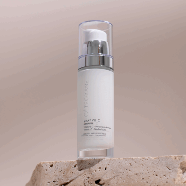Teoxane RHA Vit C Serum 30ml elegantly styled on a light surface with soft lighting, evoking radiance and advanced skincare