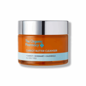 The Organic Pharmacy Carrot Butter Cleanser 50ml jar with orange label, formulated to gently cleanse and nourish the skin.
