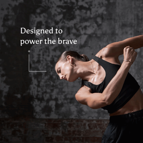 Woman showcasing strong, toned muscles, representing the benefits of Ancient and Brave True Creatine Sachets 15 x 6g for muscle strength and performance