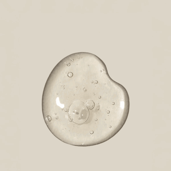 Close-up texture of Alpha Super Serum 25ml showing lightweight hydrating formula.