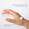 Close-up of a hand with Priori Hand and Body Replenisher cream applied, with key product benefits displayed.