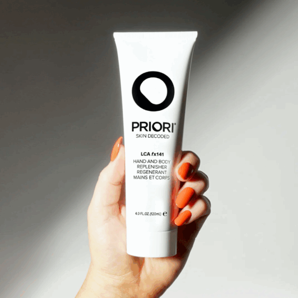 Priori Hand and Body Replenisher LCA FX 141 120ml held in hand, showcasing its hydrating and nourishing benefits for skin.
