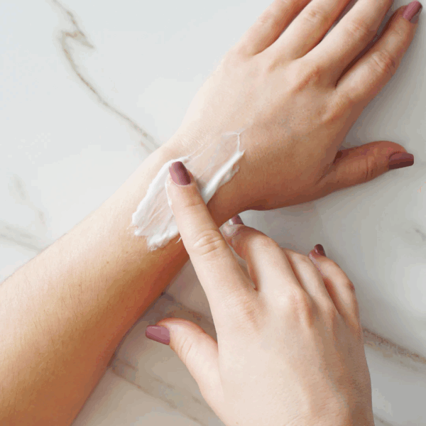 Priori Hand and Body Replenisher being applied on hand, showing moisturizing and nourishing effects.