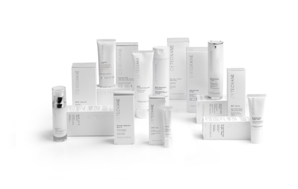 Teoxane Deep Repair Balm 30ml displayed with its packaging and other Teoxane products on white background.