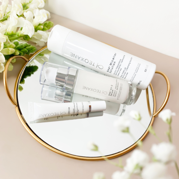 Teoxane 3D Lip 10ml displayed with other Teoxane products and a mirror, reflecting a complete beauty routine setup