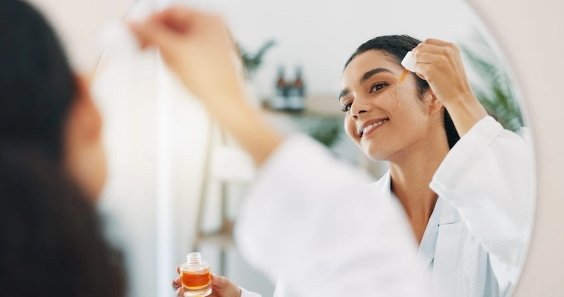 woman using a scar serum for acne