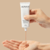 Applying Alpha-H Protection Plus Daily sunscreen, demonstrating high SPF coverage and lightweight, protective formula.