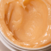 Close-up of Alpha-H Melting Moment Cleansing Balm 18g in jar, showing rich, buttery texture.